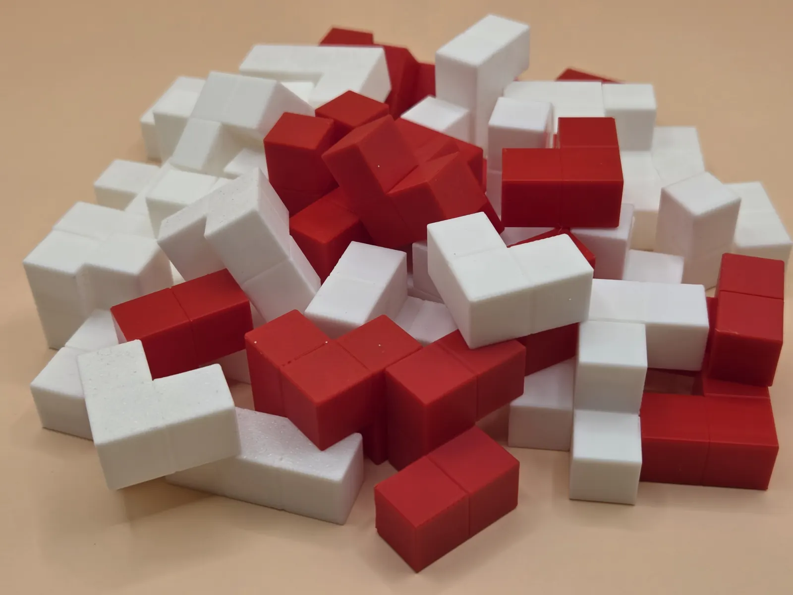 Close-up of red and white polycube pieces