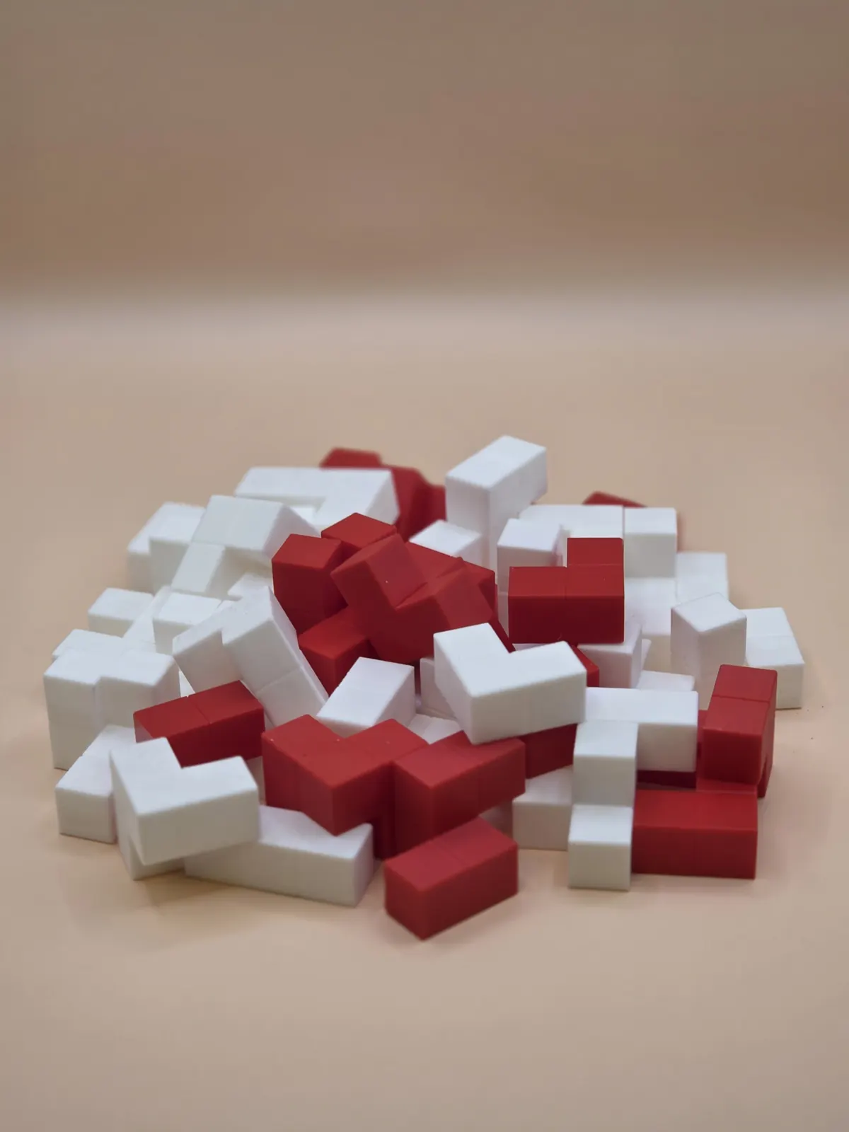 A heap of red and white polycube pieces